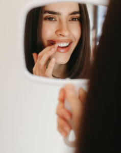 smiling woman with white teeth at russo dds in raleigh north carolina smiling teeth