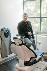 smiling dr justin russo in his olde raleigh office close to downtown offering high quality comfort focused care for cosmetic and general dentistry needs